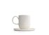The photo shows a white porcelain coffee mug with saucer. It holds 330 ml and features the SONNENTOR letters..